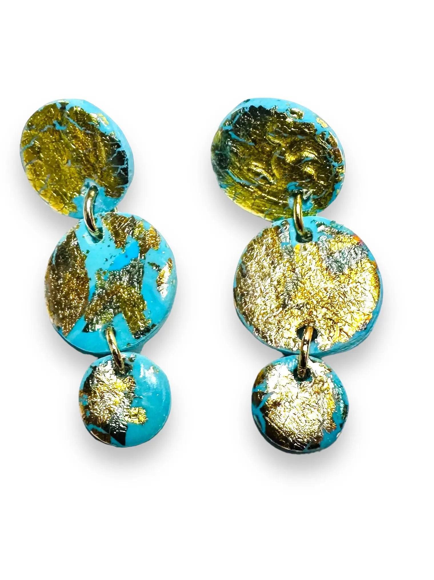 Triple disc drop earrings in turquoise polymer clay with gold foil, offering a bold and affordable gift option.