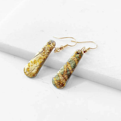 Gold Shine polymer clay earrings featuring textured shimmer design and gold plated hooks. Unique and affordable accessory.