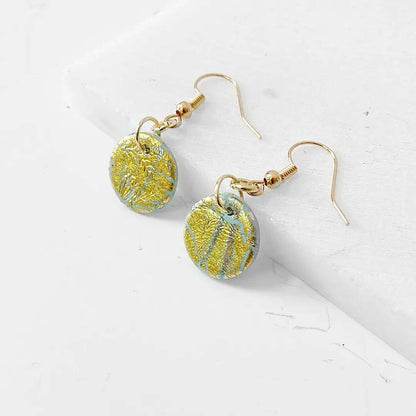 Small round polymer clay earrings in gold and green shimmer. Lightweight and perfect for everyday wear.