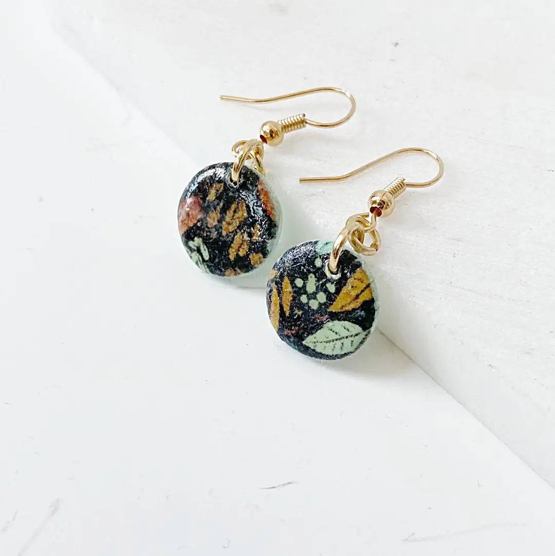 Round polymer clay earrings with botanical print and gold plated earwires. Stylish and budget-friendly gift.