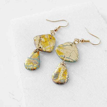 Gold Shine polymer clay earrings with layered drop design and shimmer finish. Perfect for gifting or accessorizing.