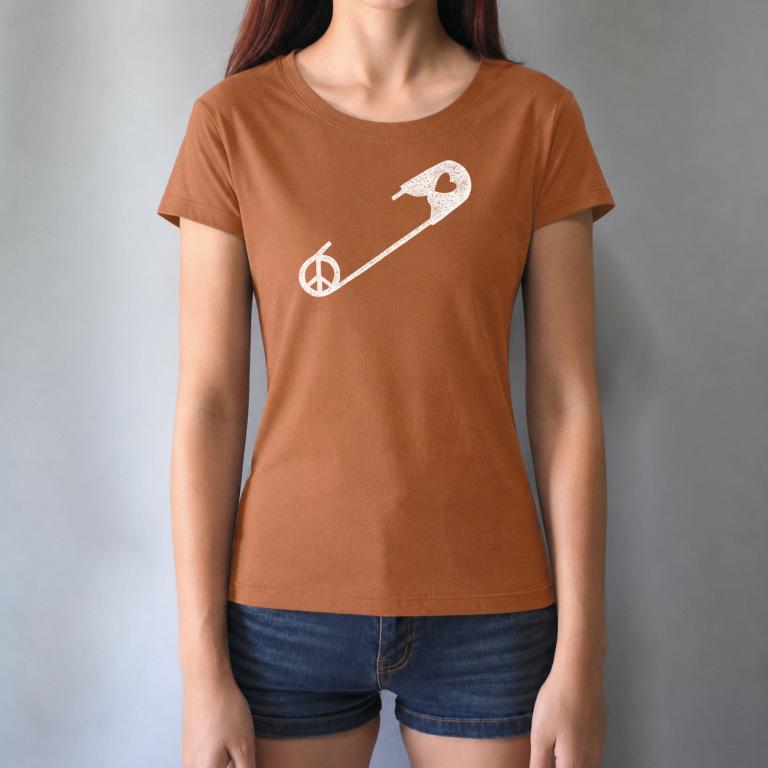 Rust-colored Women's Peace & Love T-Shirt with white safety pin design, worn by model. Ethical fashion statement for unity and kindness.