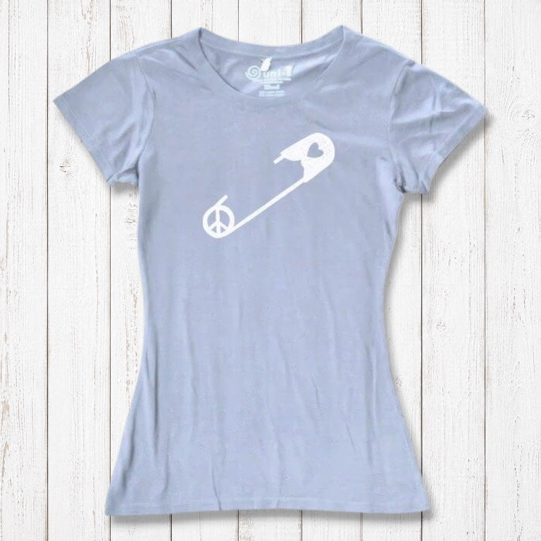 Light blue Women's Peace & Love T-Shirt with white safety pin graphic, laid flat. Eco-conscious tee promoting unity and acceptance.