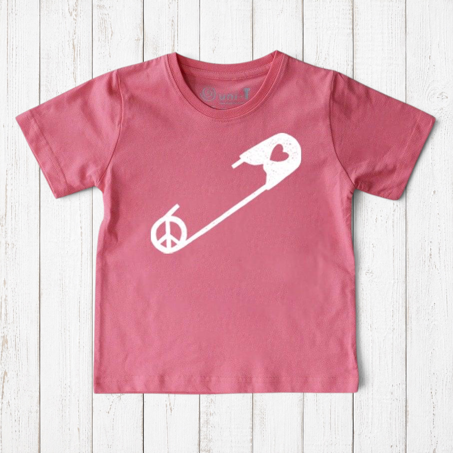 Pink Kids' Safety Pin Organic Cotton T-Shirt featuring white peace and heart graphic, a soft, sustainable top promoting kindness by Uni-T.