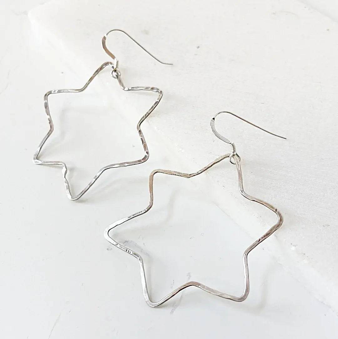 Lightweight Sterling Silver Star Hoops featuring hammered 6-point star design, perfect for casual or stylish accessory looks.