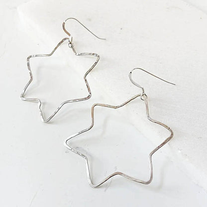 Lightweight Sterling Silver Star Hoops featuring hammered 6-point star design, perfect for casual or stylish accessory looks.