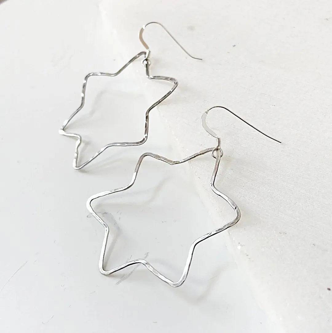 Silver Star Hoops in sterling silver with a unique 6-point star outline, lightweight and versatile for daily wear.