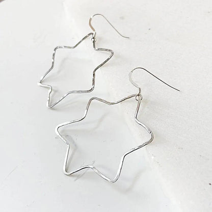 Silver Star Hoops in sterling silver with a unique 6-point star outline, lightweight and versatile for daily wear.