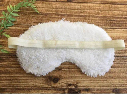 Back view of cotton sleep mask for relaxation showing plush Sherpa fabric and elastic 12-inch band. Designed for a snug, cozy fit.