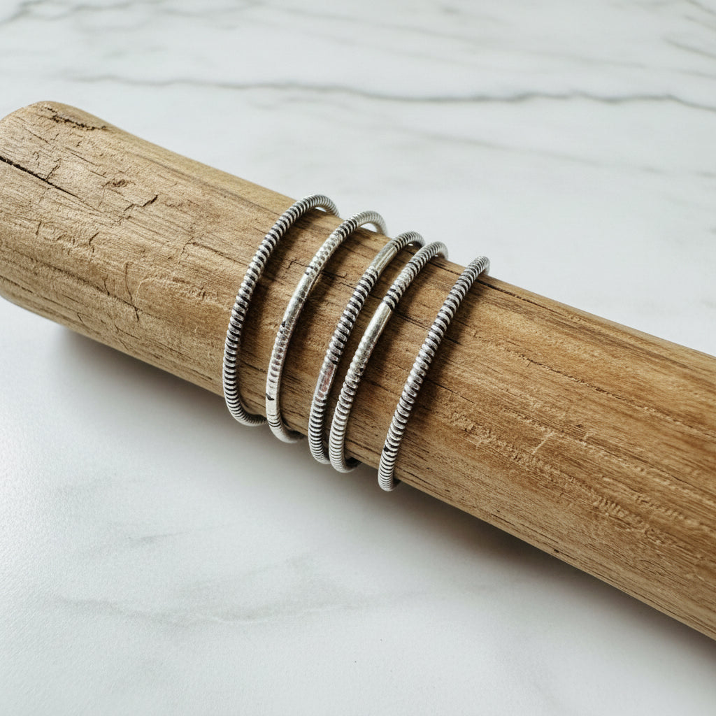 Silver Twist Pattern Ring on wood