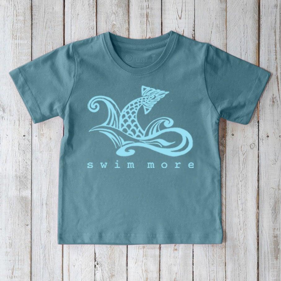 Blue Kids' Swim Organic Cotton T-Shirt with light blue swimmer graphic and 'swim more' text, eco-conscious athletic top for children by Uni-T.
