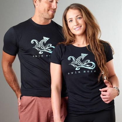 Couple wearing black 'Swim More' graphic tees made from bamboo and organic cotton. Stylish fitness and beach gift for swimmers by Uni-T.