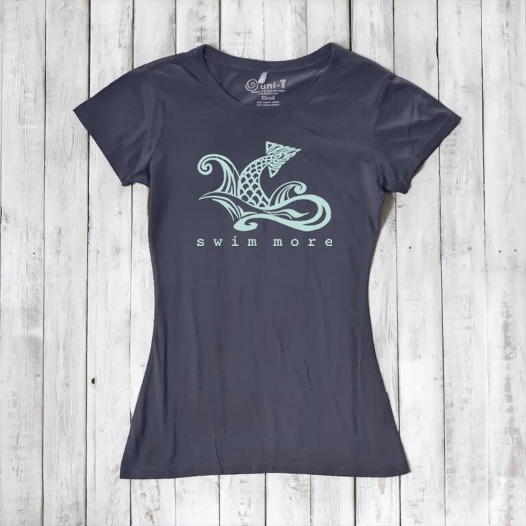 Dark navy women's 'Swim More' T-shirt in bamboo and organic cotton. Sustainable ocean-themed top for active beach lovers by Uni-T.
