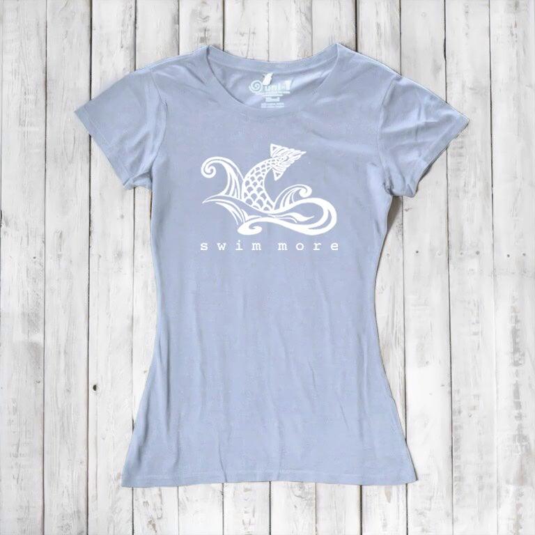 Light blue women's bamboo and organic cotton tee with white 'Swim More' graphic. Soft and breathable gift for swimmers by Uni-T.