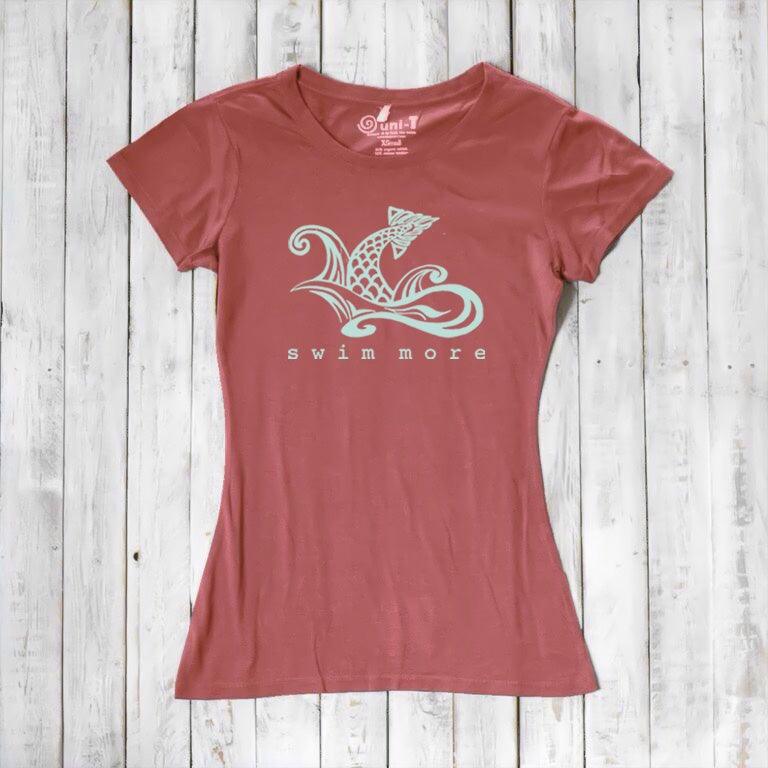 Coral red women's 'Swim More' T-shirt in bamboo and organic cotton. Ocean-inspired graphic top for active women by Uni-T.