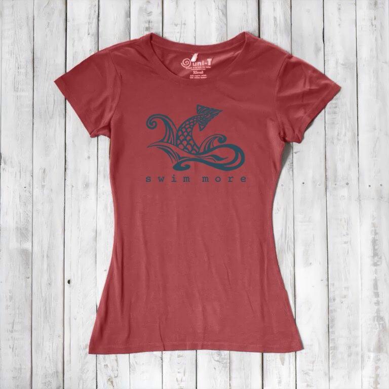 Brick red women's bamboo and organic cotton tee with navy 'Swim More' graphic. Comfortable and sustainable swim-themed shirt by Uni-T.