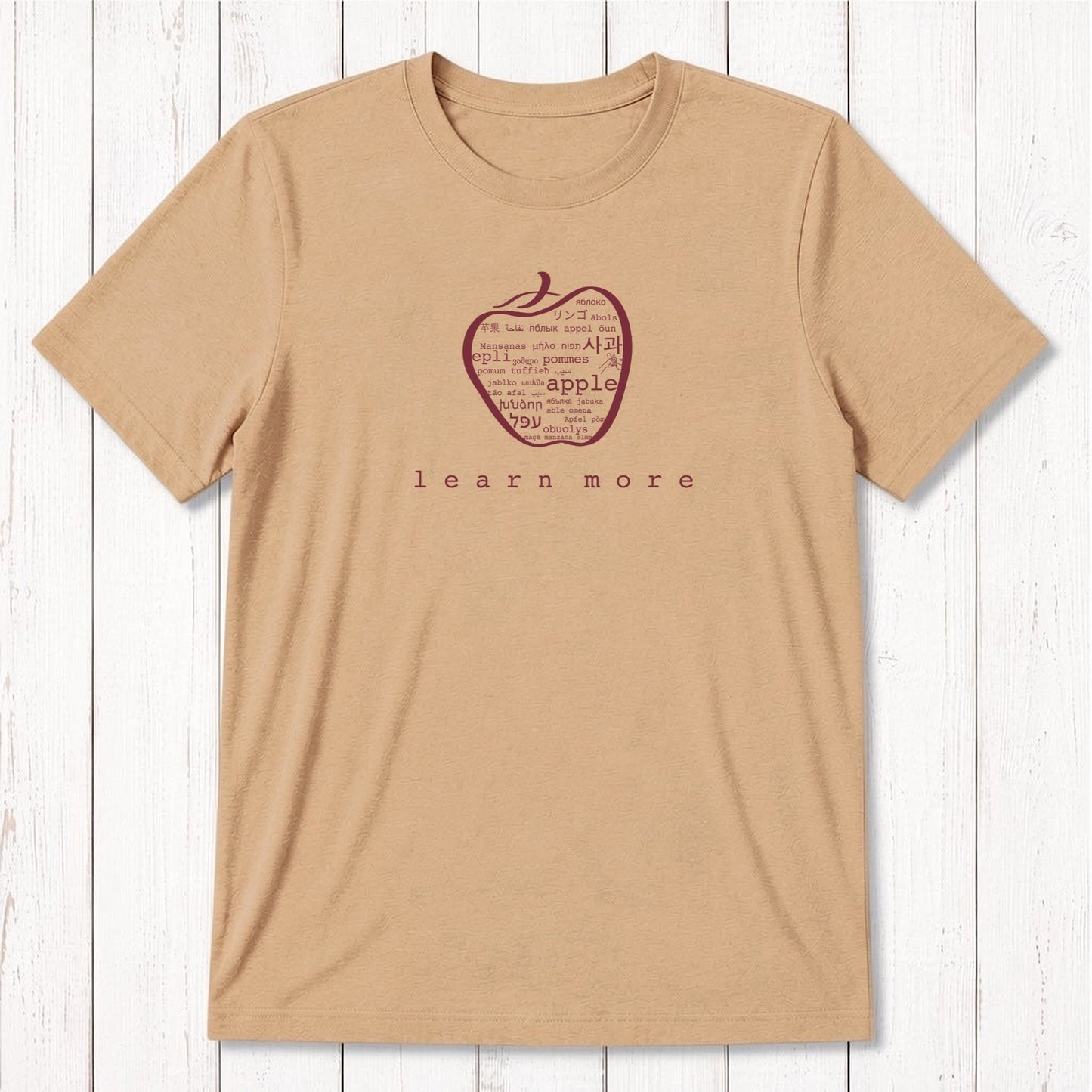 Tan Men's Bamboo & Organic Cotton Teacher T-Shirt with white apple graphic and 'learn more' text, sustainable gift for professors.