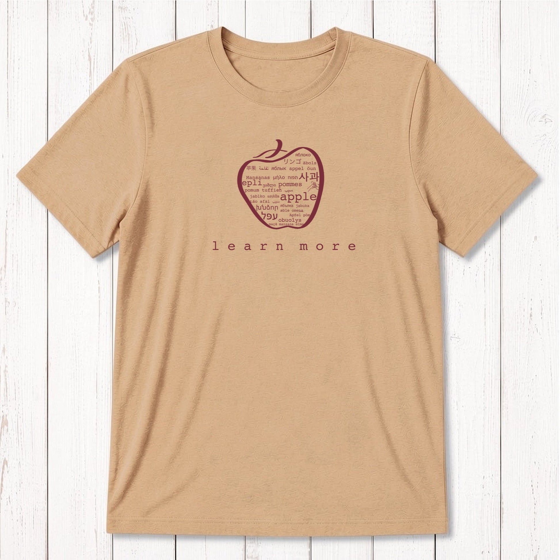 Tan Men's Bamboo & Organic Cotton Teacher T-Shirt with white apple graphic and 'learn more' text, sustainable gift for professors.