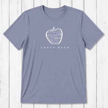 Lavender Uni-T Inspirational Graphic Tee for men with white apple design and 'learn more' slogan, eco-friendly teacher apparel.