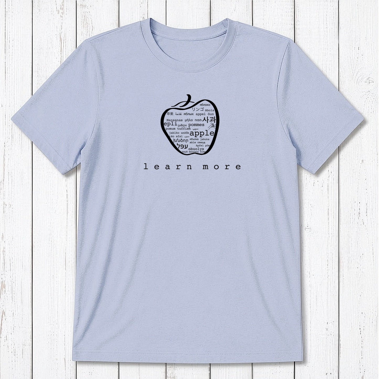 Light blue Men's Teacher T-Shirt in Bamboo & Organic Cotton with green apple graphic and 'learn more' text, perfect educator gift.