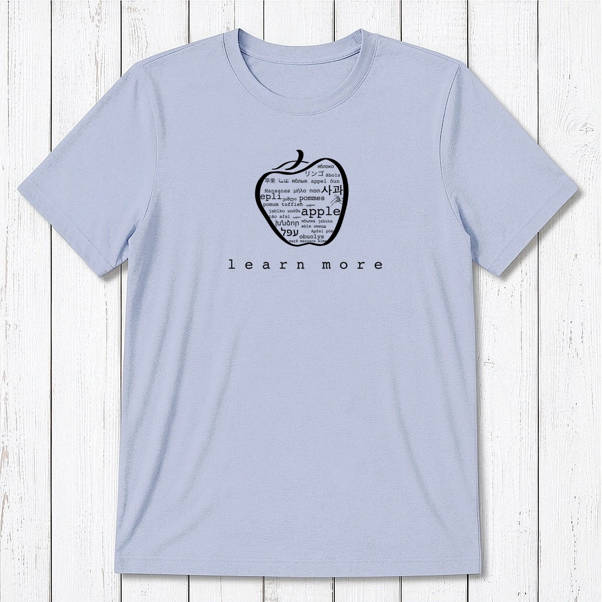 Light blue Men's Teacher T-Shirt in Bamboo & Organic Cotton with green apple graphic and 'learn more' text, perfect educator gift.
