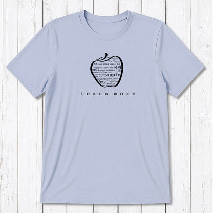 Light blue Men's Teacher T-Shirt in Bamboo & Organic Cotton with green apple graphic and 'learn more' text, perfect educator gift.