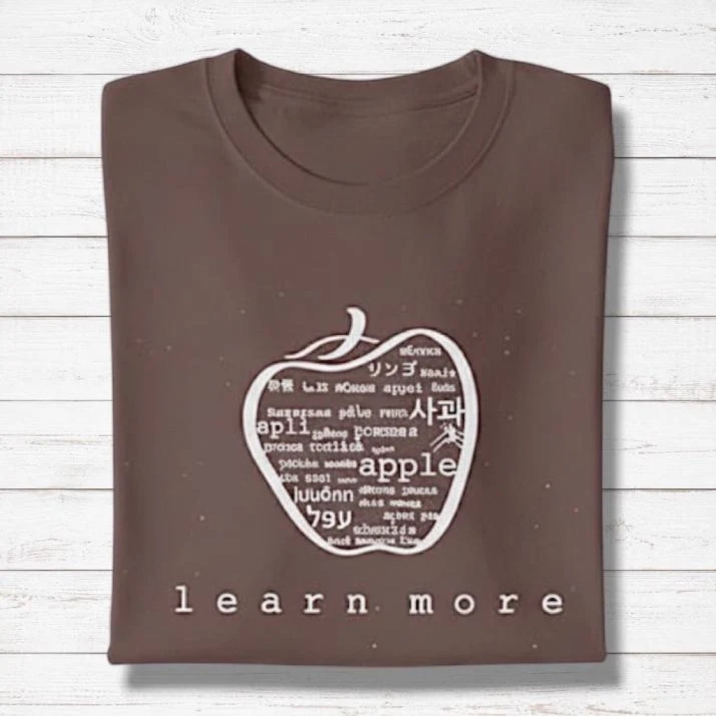 Brown Men's Bamboo & Organic Cotton Graphic T-Shirt with white apple design and 'learn more' text, thoughtful gift for teachers.