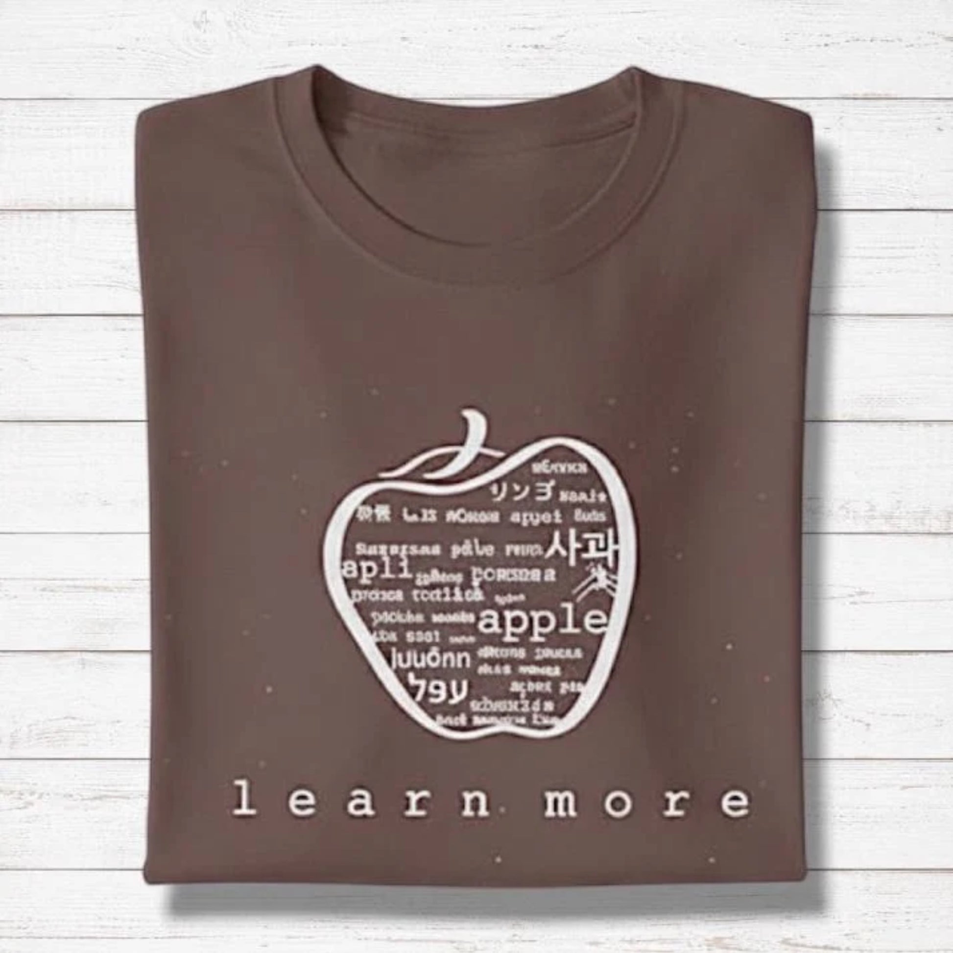 Brown Men's Bamboo & Organic Cotton Graphic T-Shirt with white apple design and 'learn more' text, thoughtful gift for teachers.