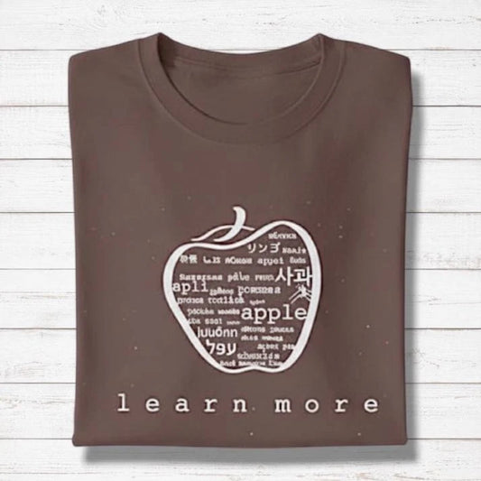 Brown Men's Bamboo & Organic Cotton Graphic T-Shirt with white apple design and 'learn more' text, thoughtful gift for teachers.