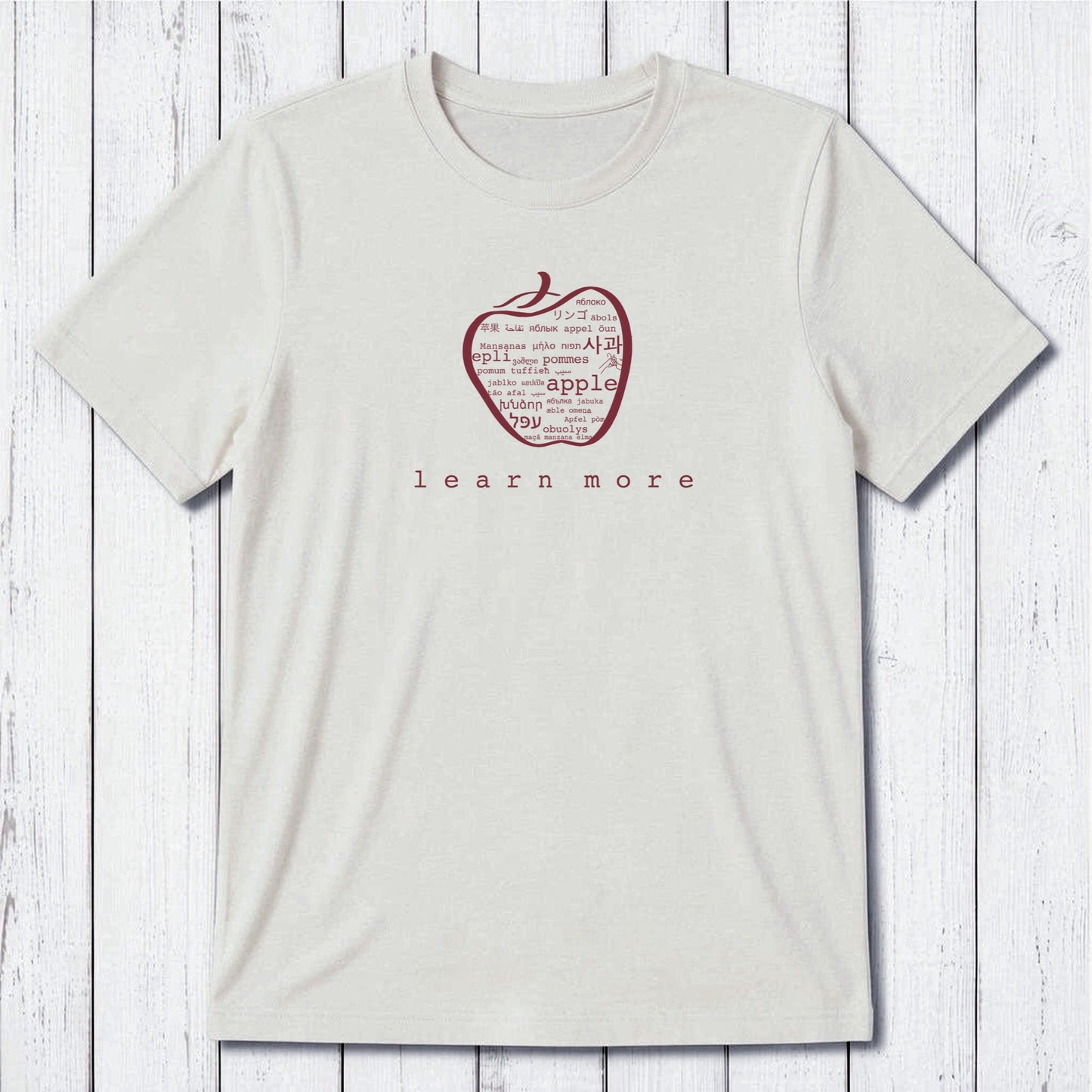 White Uni-T Inspirational Graphic Tee for men with green apple graphic and 'learn more' slogan, sustainable gift for educators.