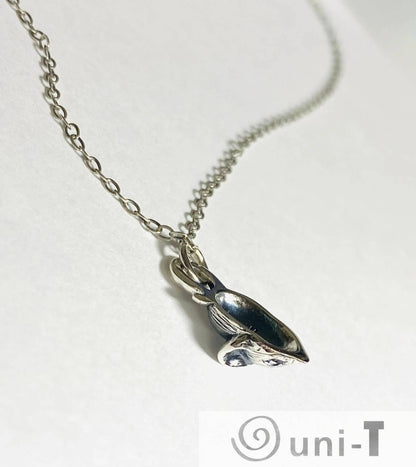 Close-up of Silver Mouse Necklace, Delicate Chain and Mouse Pendant, Jewelry Accessory