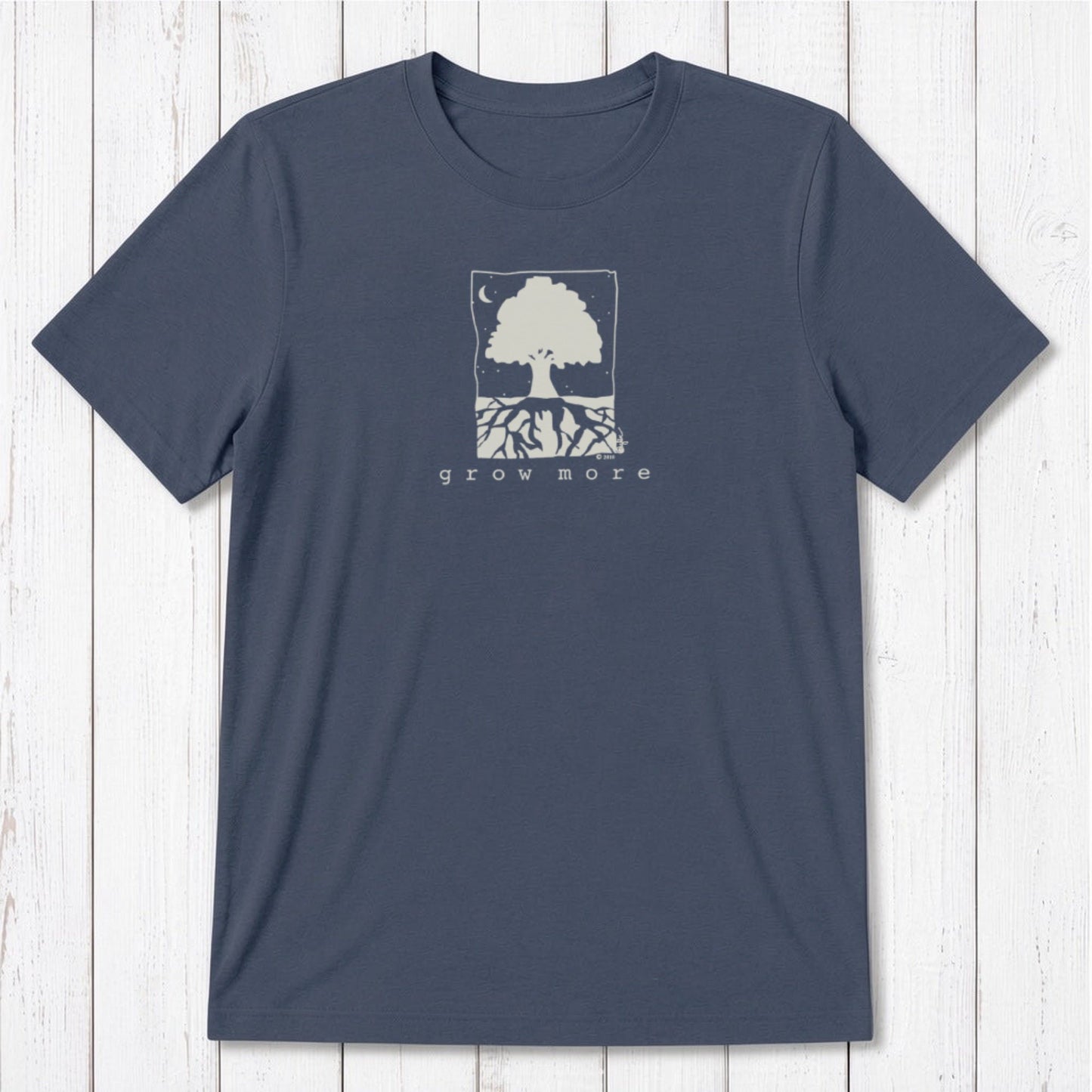 Classic fit navy blue men's bamboo and organic cotton t-shirt with white tree and root 'Grow More' gardening graphic.