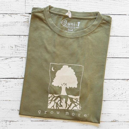 Men's Tree T-Shirt in Bamboo & Organic Cotton in olive green with 'Grow More' graphic, folded on white wood background.