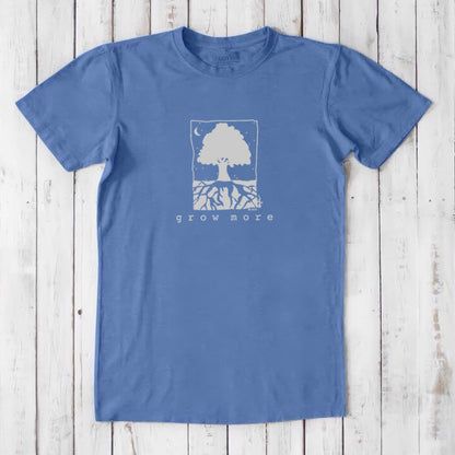 Sky blue men's 'Grow More' tree graphic t-shirt in bamboo and organic cotton, laid flat on rustic wood background.