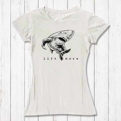 Natural white bamboo and organic cotton women's T-shirt featuring a shark and 'Lift More' text. Sustainable workout wear for lifters.