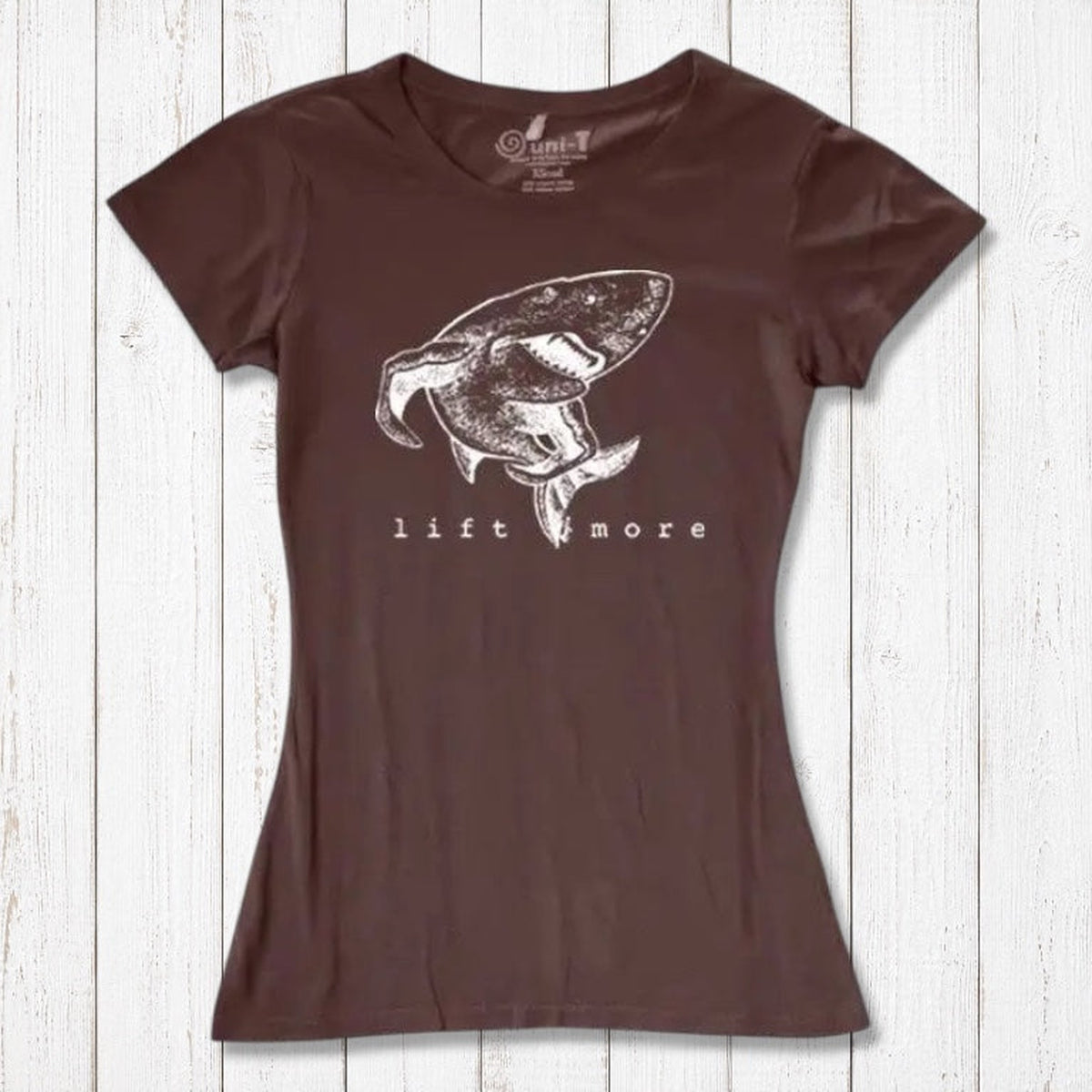 Brown eco-friendly women's T-shirt with shark and 'Lift More' graphic. Bamboo and organic cotton blend for gym and casual wear.