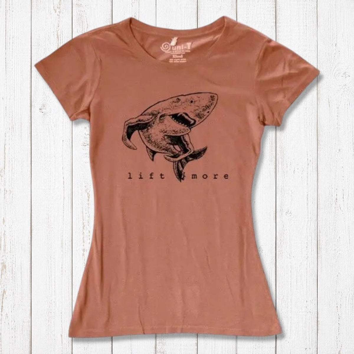 Terracotta women's T-shirt with shark and 'Lift More' graphic, made from bamboo and organic cotton. Eco-conscious gym apparel.