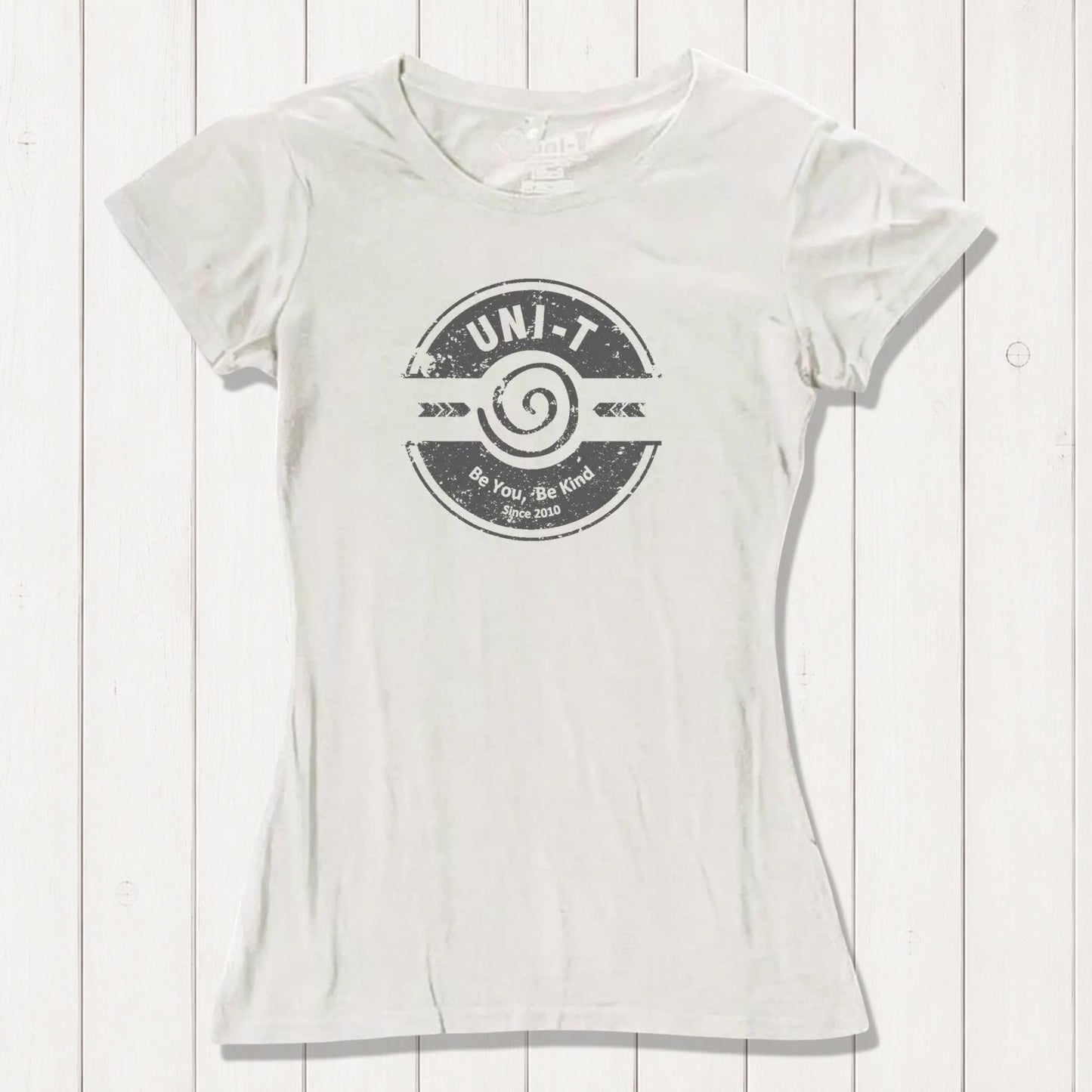 Cream-colored inspirational women's T-shirt made from bamboo and organic cotton featuring Uni-T's 'Be You Be Kind' positive vibe graphic.