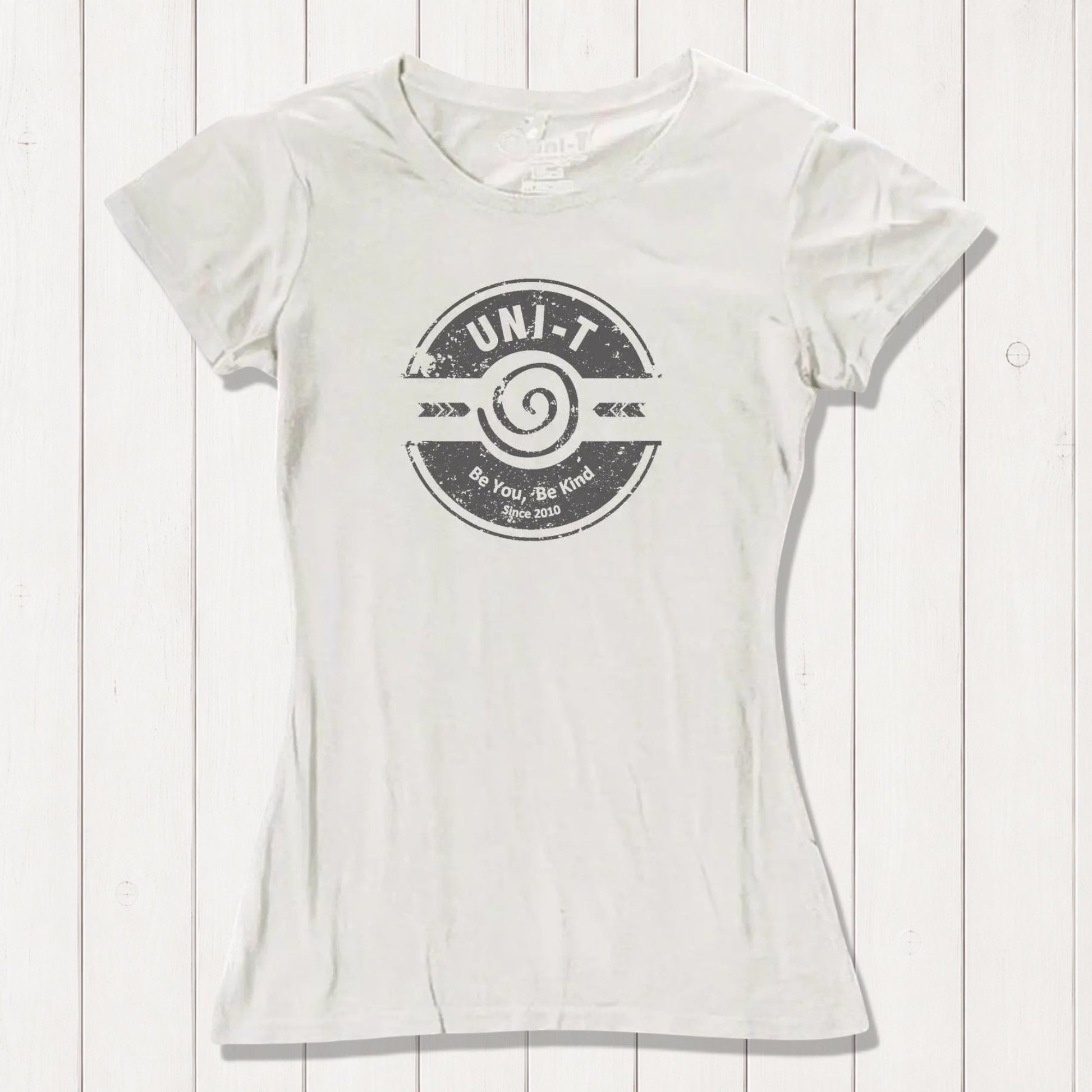 Cream-colored inspirational women's T-shirt made from bamboo and organic cotton featuring Uni-T's 'Be You Be Kind' positive vibe graphic.
