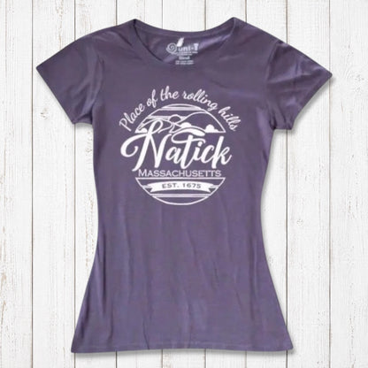 Purple women's Natick T-Shirt in bamboo and organic cotton blend with 'Place of the Rolling Hills' Massachusetts graphic. Eco-friendly local pride clothing.