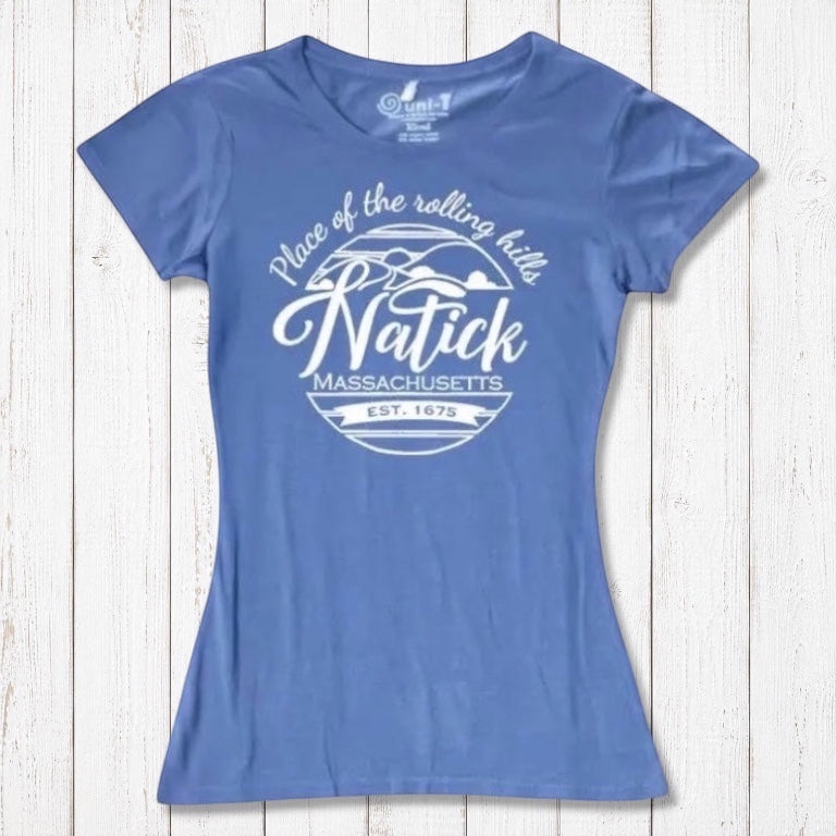 Sky blue Natick T-Shirt for women made from bamboo and organic cotton, showcasing 'Place of the Rolling Hills' Massachusetts hometown pride graphic. Sustainable gift idea.