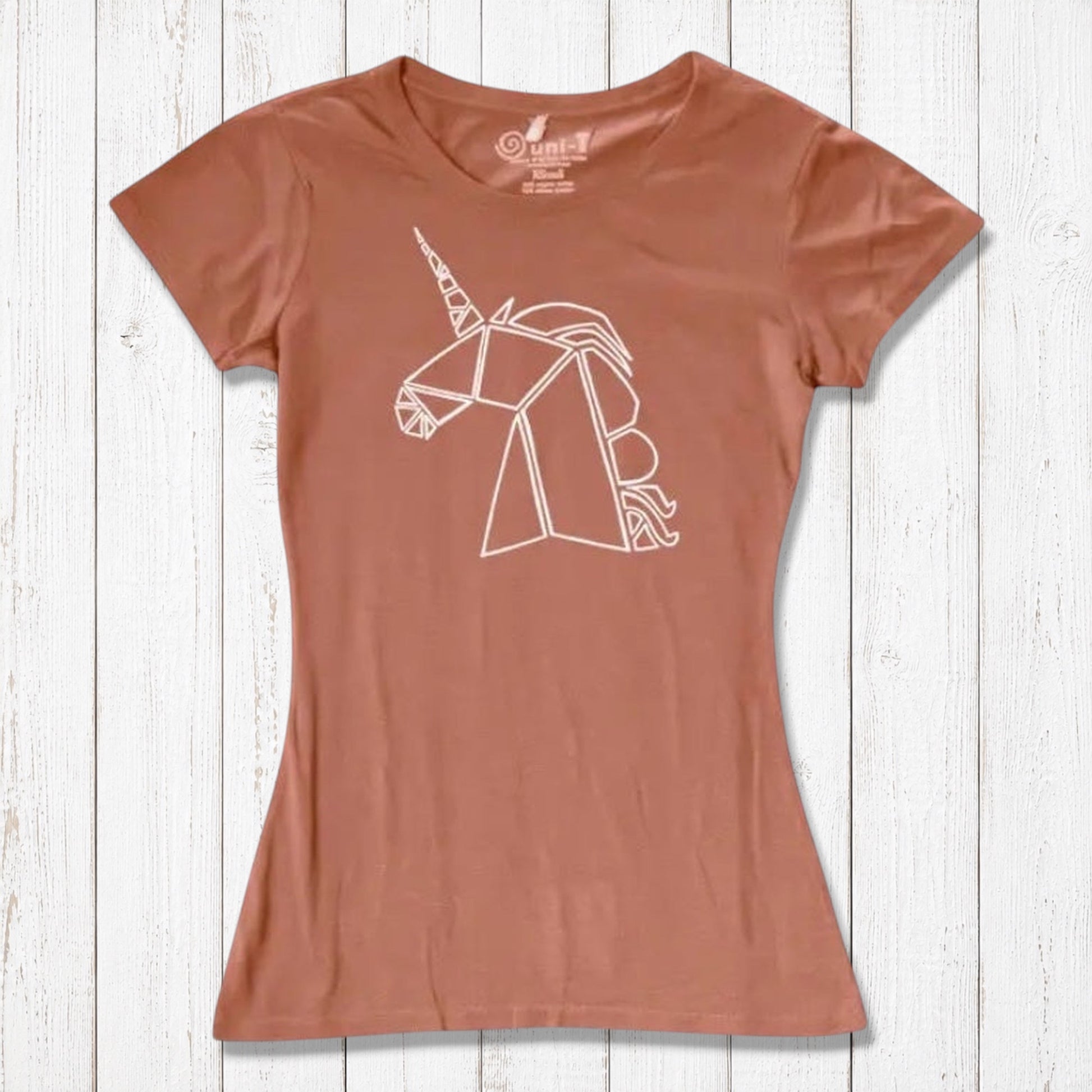 Rust orange Women’s Unicorn T-Shirt in bamboo and organic cotton featuring a white geometric unicorn. Sustainable and whimsical top for her.