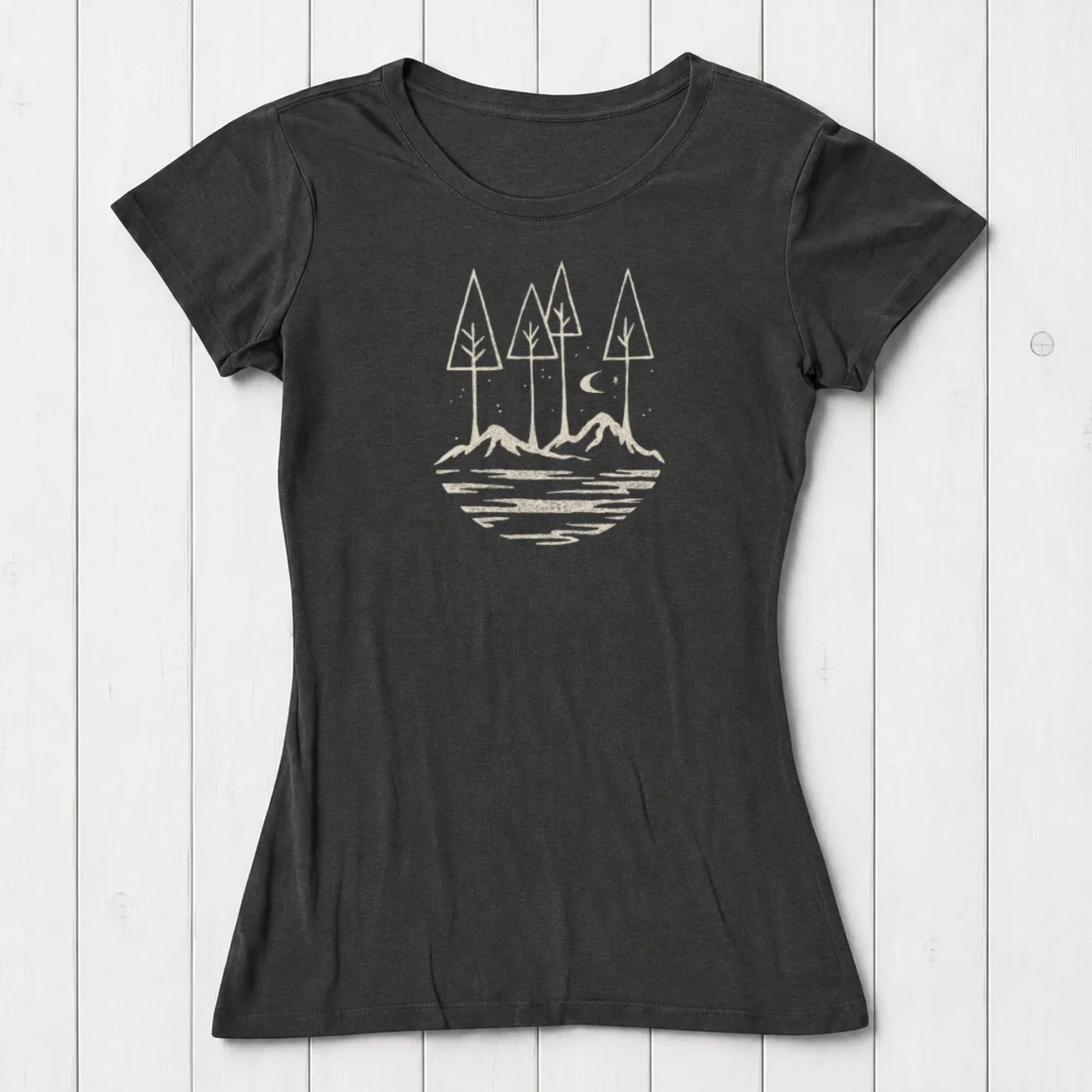 Black sustainable women's t-shirt with outdoor-inspired graphic of trees, mountains, and moon. Ideal gift for hikers and nature lovers.