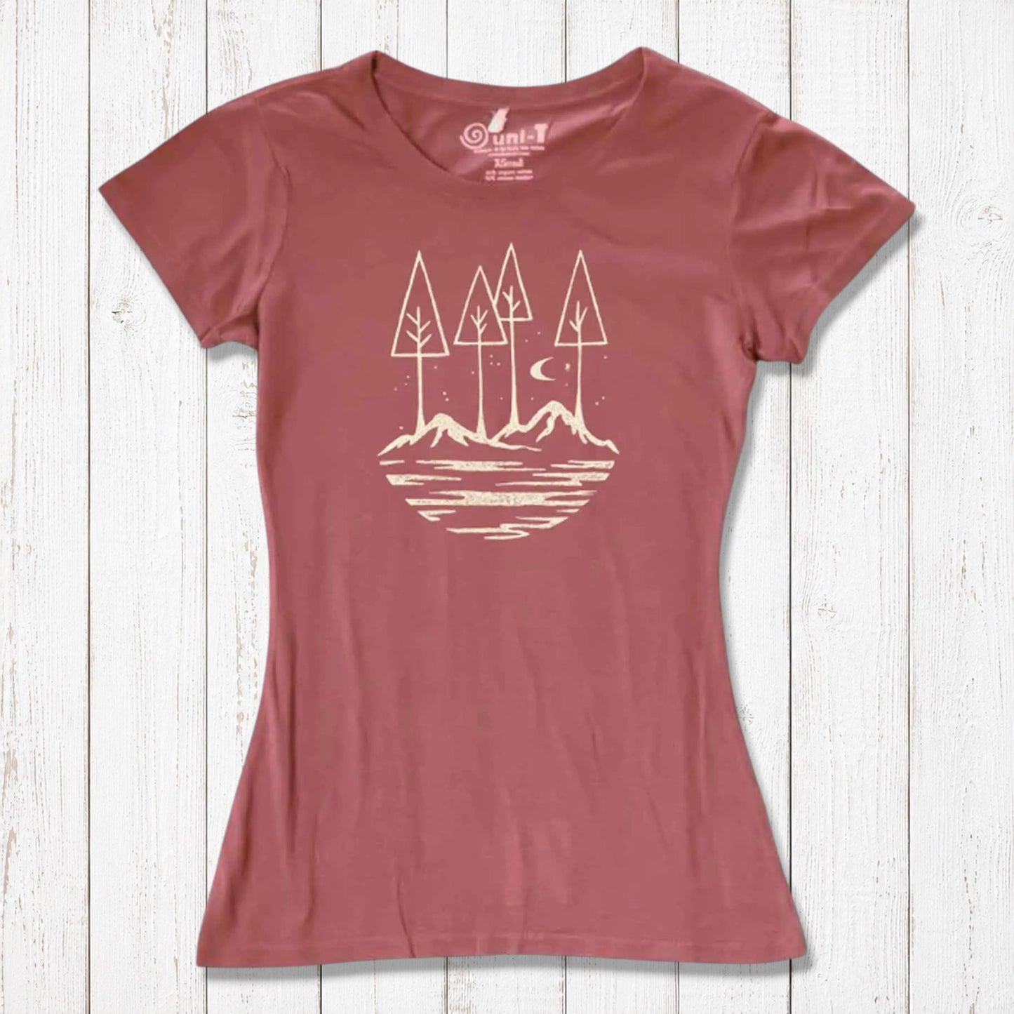 Rust red women's nature lover t-shirt made from bamboo and organic cotton. Features serene mountain and tree graphic for outdoor enthusiasts.