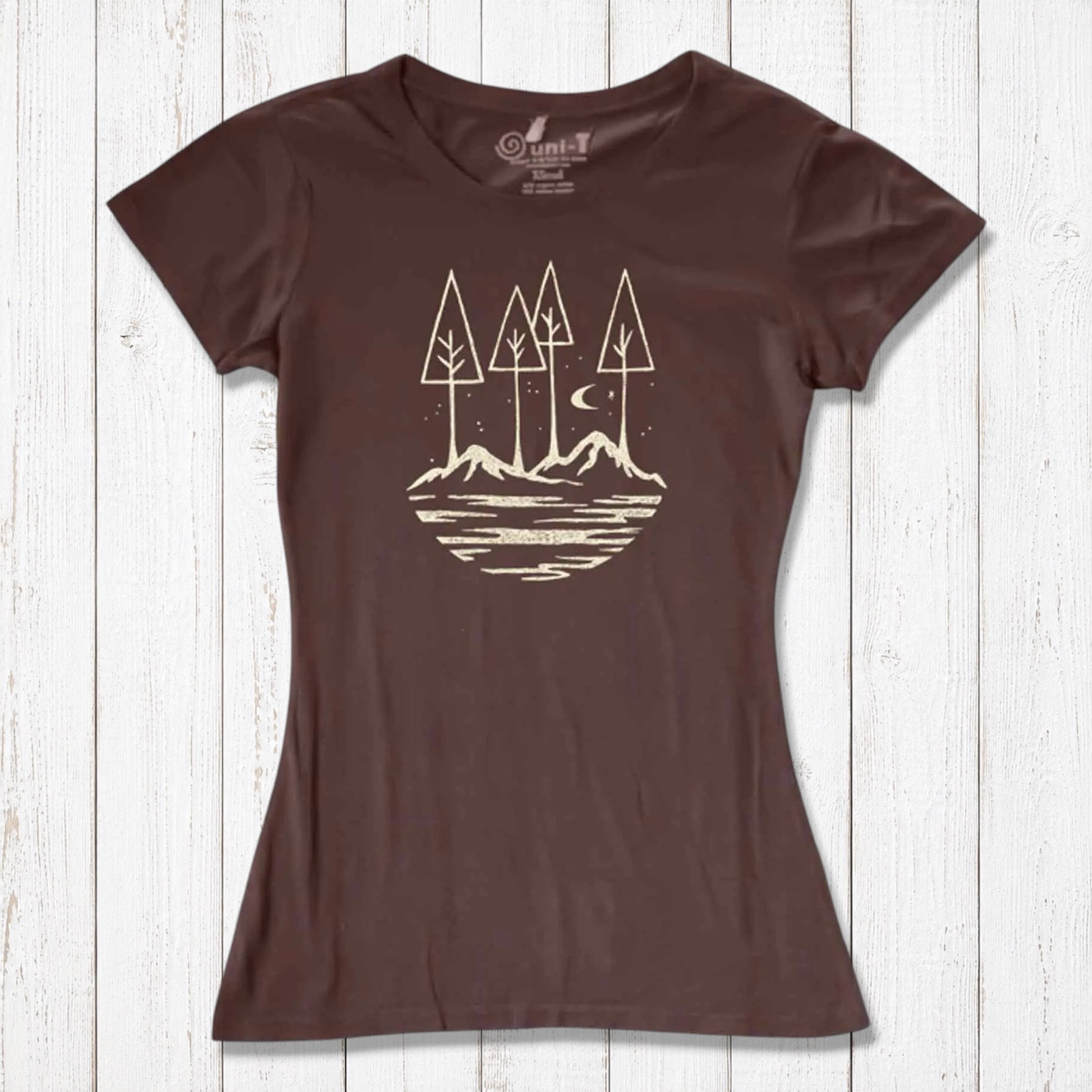 Brown eco-friendly women's graphic tee with minimalist forest and mountain design. Sustainable fashion for nature lovers and hikers.