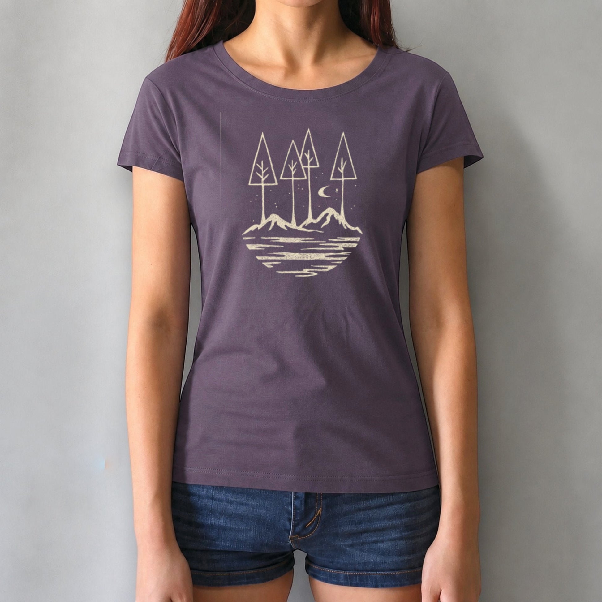Purple women's bamboo and organic cotton tee with scenic mountain and tree design. Positive vibe graphic for eco-conscious adventurers.