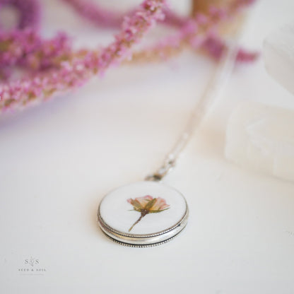 Silver Valentine Round Rose Necklace pendant with preserved rose detail, highlighting its handcrafted charm and hypoallergenic chain.