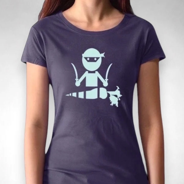 Model wearing navy 'Veggie Ninja' vegan T-shirt for women, featuring a mint green ninja and carrot graphic on sustainable fabric.