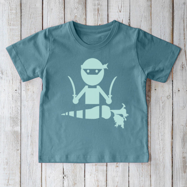Sustainable Kids' Veggie Ninja Organic Cotton T-Shirt in aqua blue, featuring a fun ninja and carrot illustration, playful top by Uni-T.
