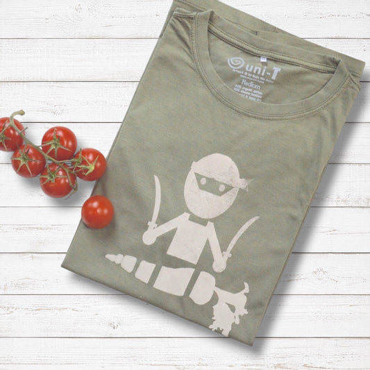 Men's Vegan T-Shirt in Bamboo & Organic Cotton in olive green with 'Veggie Ninja' graphic, folded on wood background with cherry tomatoes.
